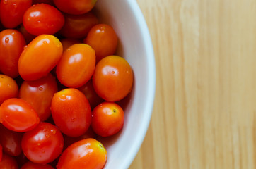 Organic Red Cherry Tomatoes In White Ceramic Bowl.