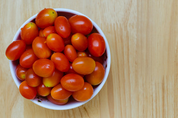 Organic Red Cherry Tomatoes In White Ceramic Bowl.