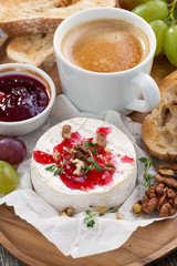gourmet breakfast- camembert with berry jam, toast, coffee 