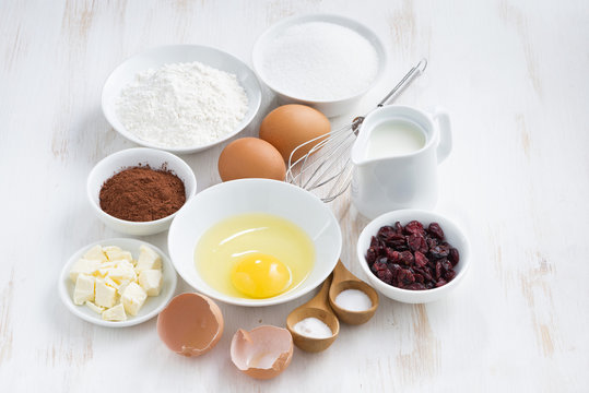 fresh ingredients for baking on a white table, top view