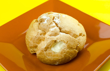 Chu cream puff on plate on yellow background / Close up images
