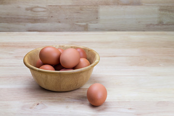 hen's eggs in wooden bowl