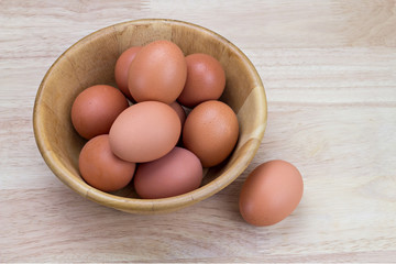 hen's eggs in wooden bowl