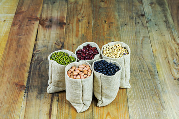 Beans on vintage wooden boards still life