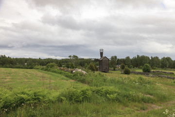 Fototapeta na wymiar Windmill in the agricultural landscape.