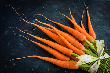 Fresh carrots with green tops.