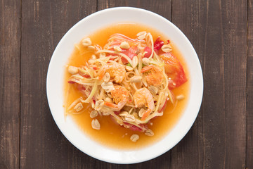 Papaya salad thai food on wooden background