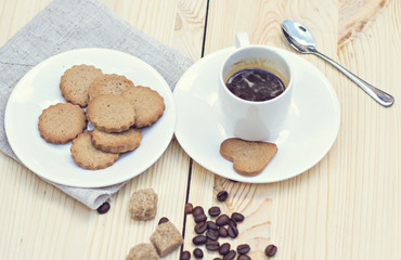 Ginger biscuits, cinnamon, a cup of hot coffee. 
