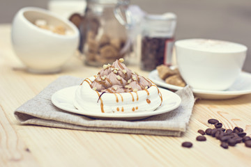 White meringues with brown chocolate stripes