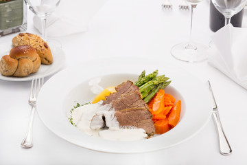 Delicious veal in white sauce served in restaurant