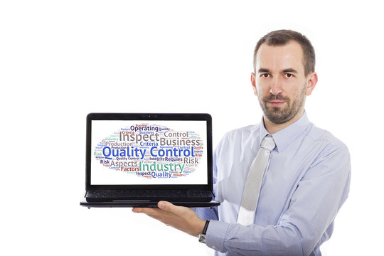 Businessman holding Laptop with Quality Control concept