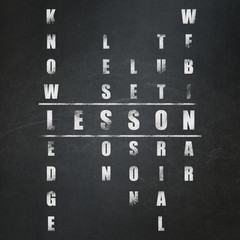 Education concept: word Lesson in solving Crossword Puzzle