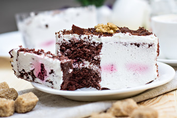Delicious chocolate cake on plate on table on light background