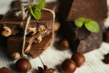 Set of chocolate on wooden table, closeup
