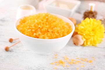 Spa still life with color sea salt on wooden table, closeup