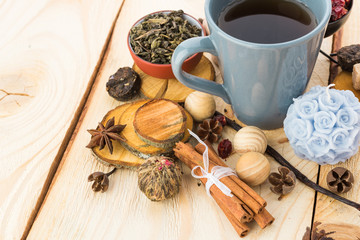 Tea cups with teapot on old wooden table