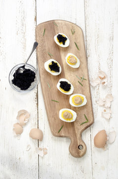 hard boiled eggs with caviar and salmon paste
