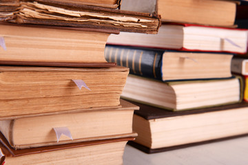 Stacks of books on table close up