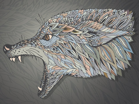 Patterned head of the wolf. Tribal ethnic totem, tattoo design.
