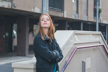 Beautiful girl posing in the city streets