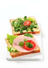 Bread with ham and salad greens