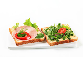 Bread with ham and salad greens
