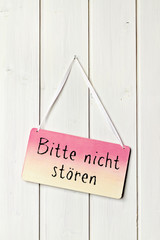 sign on white wood wall - greeting card background