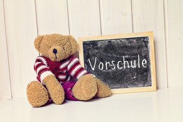 teddy bear with blackboard - greeting card background