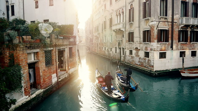 Magic drone shot of Venice Canal with 2 gondolas 