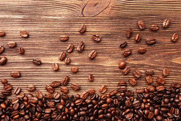 Coffee beans on wooden background