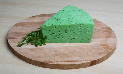 Green pesto cheese and basil leaves