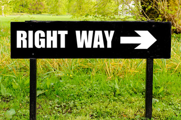 RIGHT WAY written on directional black metal sign