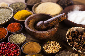Wooden table of colorful spices