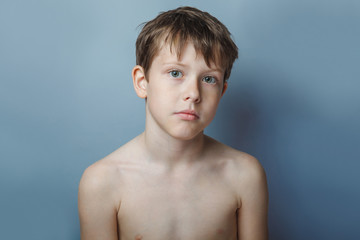 a boy of 10 years of European appearance naked torso portrait on