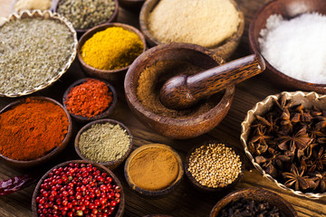 Wooden table of colorful spices