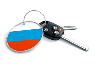 Set of car keys with keyring and country flag. Concept for car prices, buyer or selling a vehicle in Russia