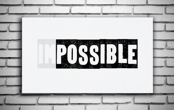 Impossible word on white board over white brick wall