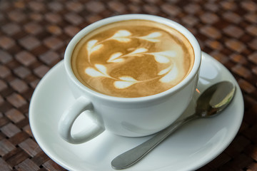 Cappuccino or latte coffee with heart shape