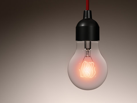 Incandescent light bulb hanging from a ceiling. Isolated.