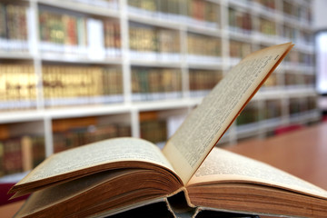 Old open book in library