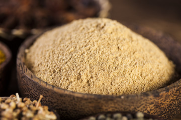 Spices and herbs in wooden bowls