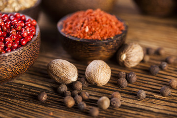 Spices and herbs in wooden bowls