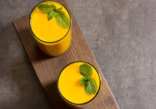 Mango lassi with copy space, overhead view