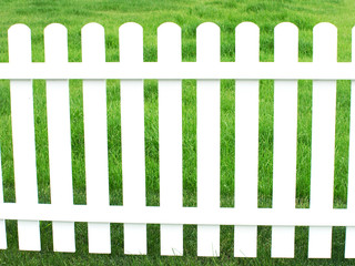 White fence and green grass.