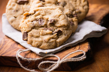 Chocolate chip cookies over olive wood board