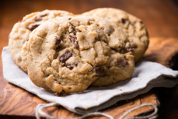 Chocolate chip cookies over olive wood board