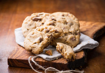 Chocolate chip cookies over olive wood board
