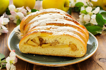 Apple pie dough with raisins in a roll.