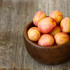 new red potatoes on wood