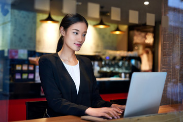 business woman laptop cafe